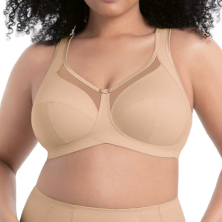 Woman wearing a beige compression garment against a white background