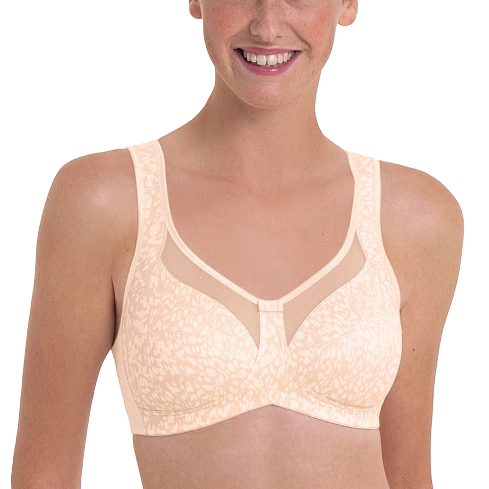 Woman wearing a beige bra on a white background