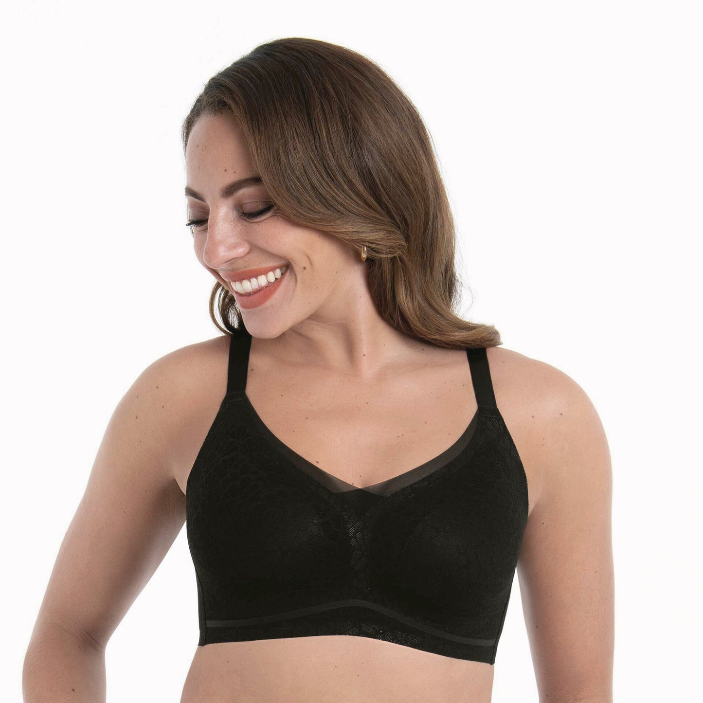 Woman wearing a black bralette on a white background