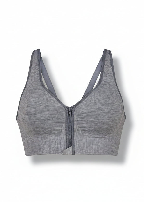 Gray sports bra with zipper on a white background