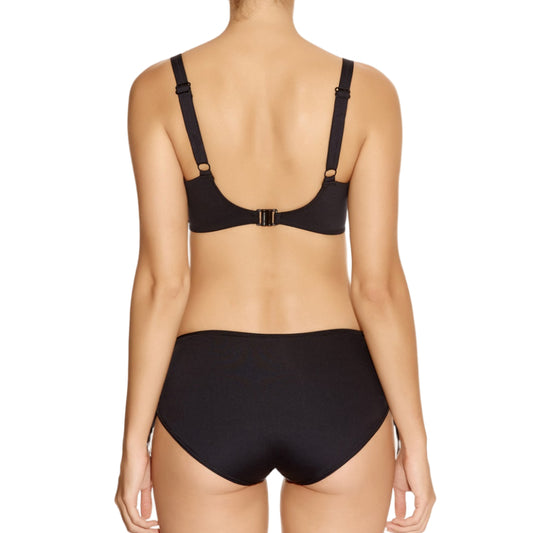 Woman wearing a bikini bra on a white background