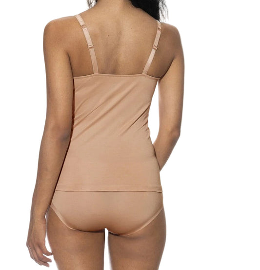 Beige bodysuit worn by a model on a white background