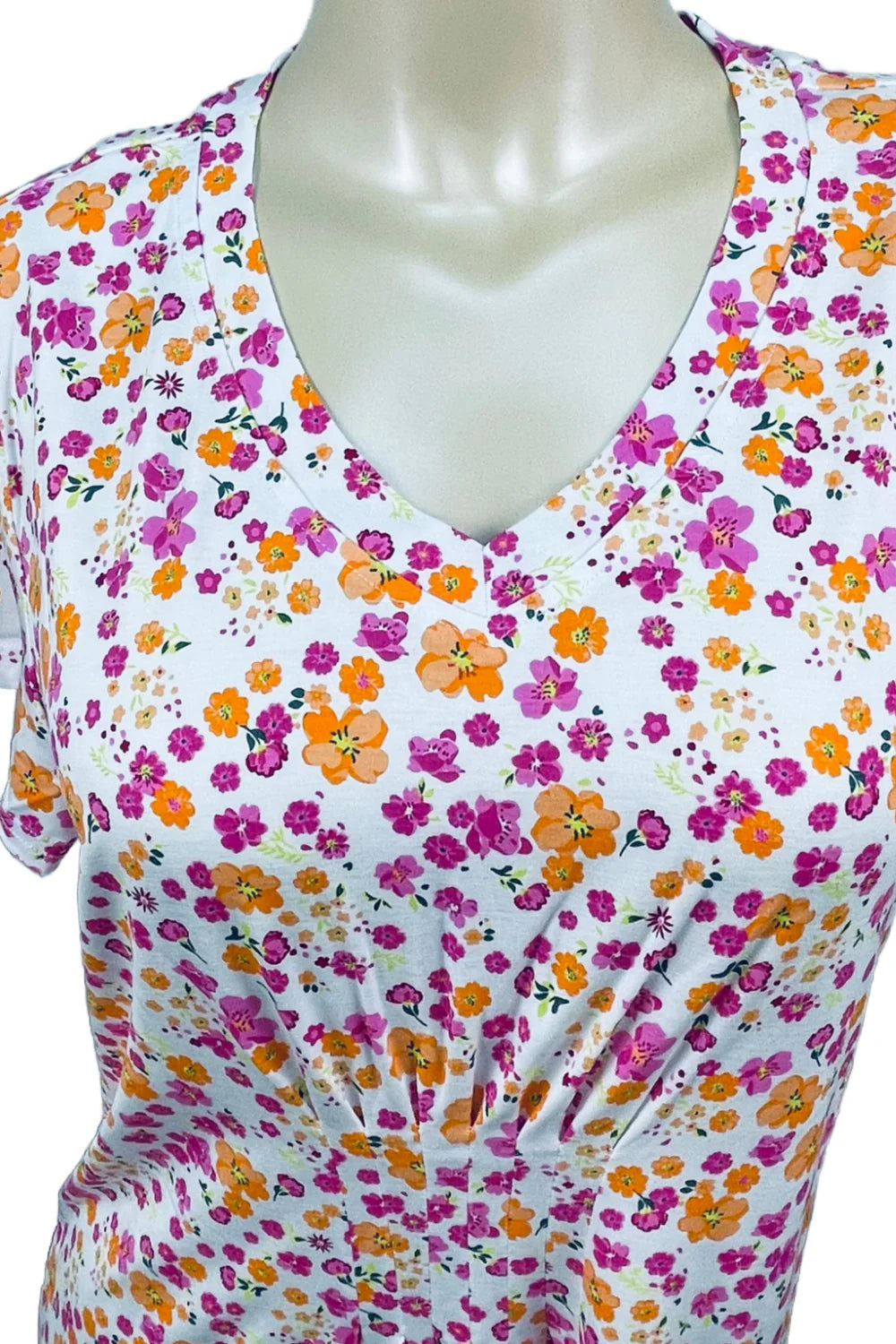 Floral-patterned top on a mannequin with a white background