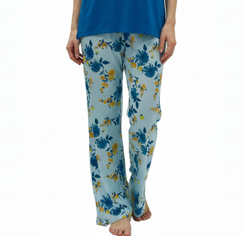 Mannequin wearing a blue top and floral pajama pants on a white background