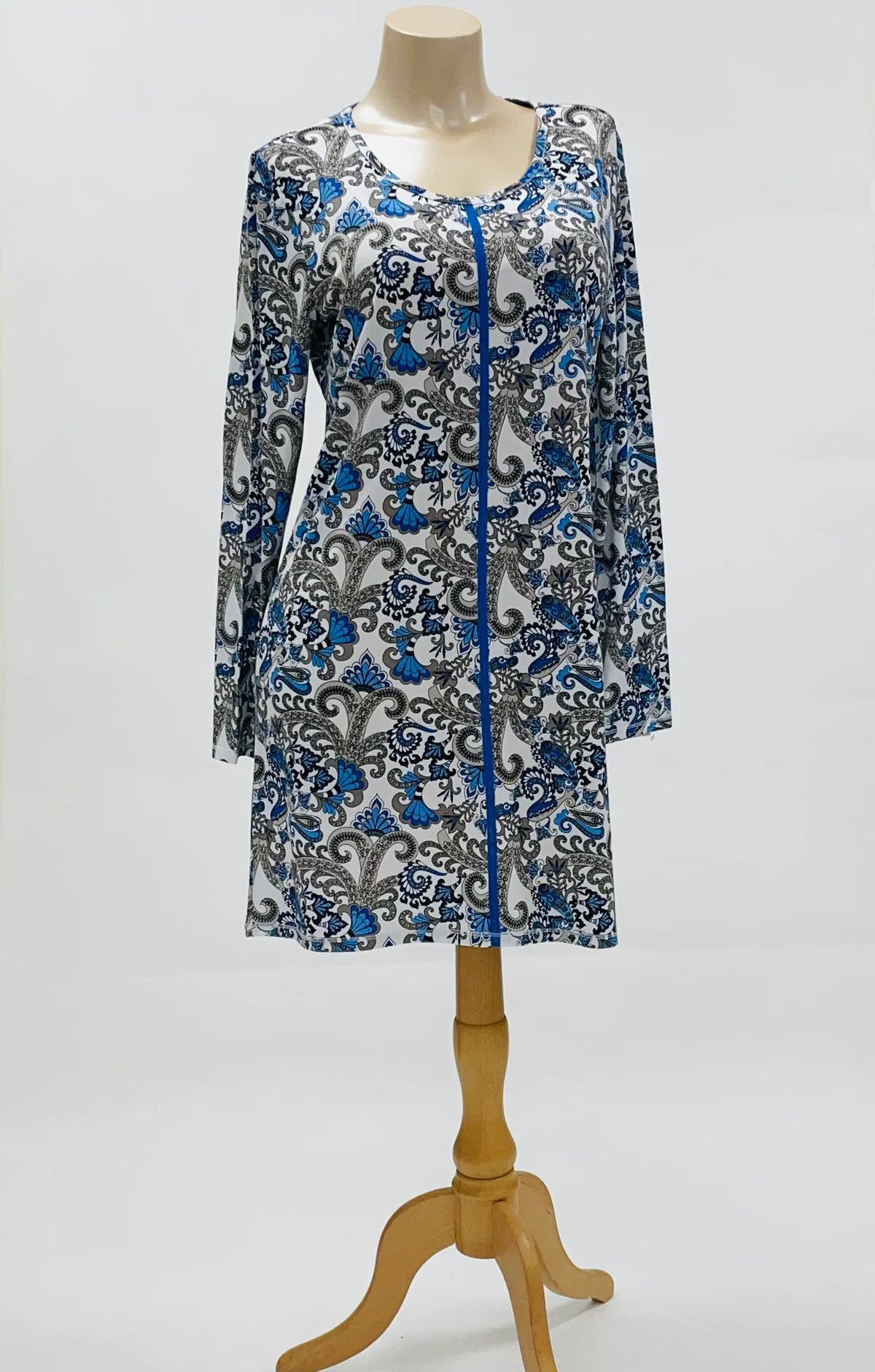 Blue and gray patterned dress on a mannequin against a white background