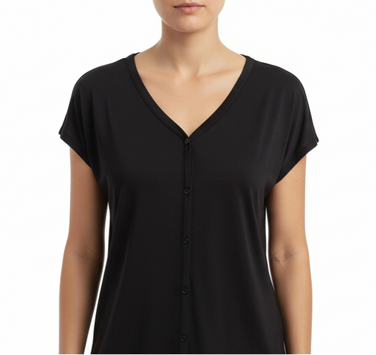 Black button-up shirt on a mannequin with a white background