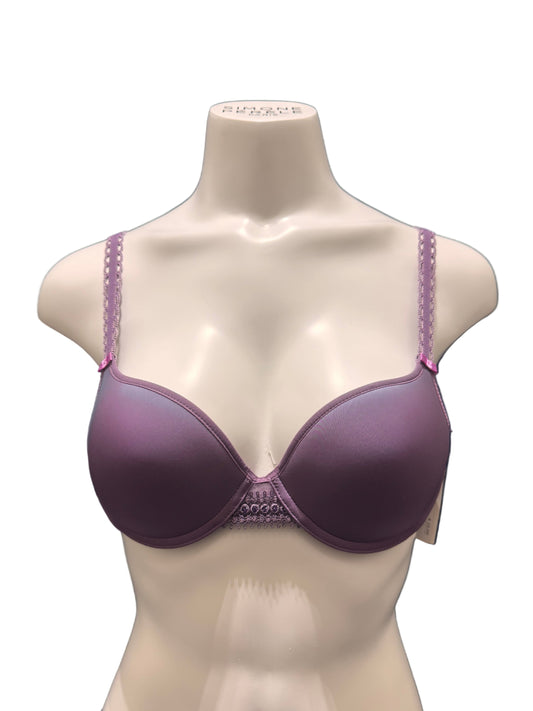 Purple bra on a mannequin bust against a dark background