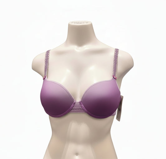 Purple bra on a mannequin bust against a dark background