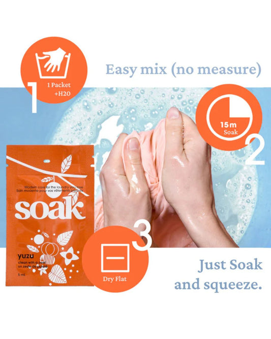 Product packaging for 'soak' with instructions on how to use it, featuring a packet and hands with soap suds.