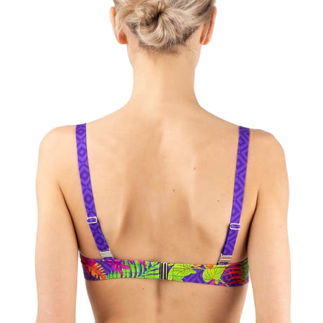 Woman wearing a colorful bikini top with purple straps on a white background