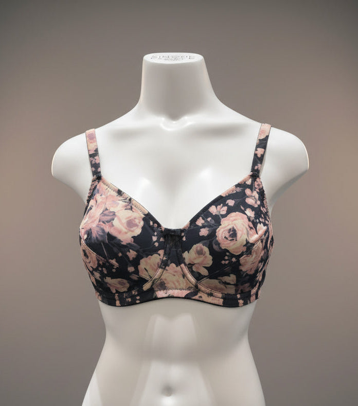 Floral-patterned bra on a mannequin against a dark background