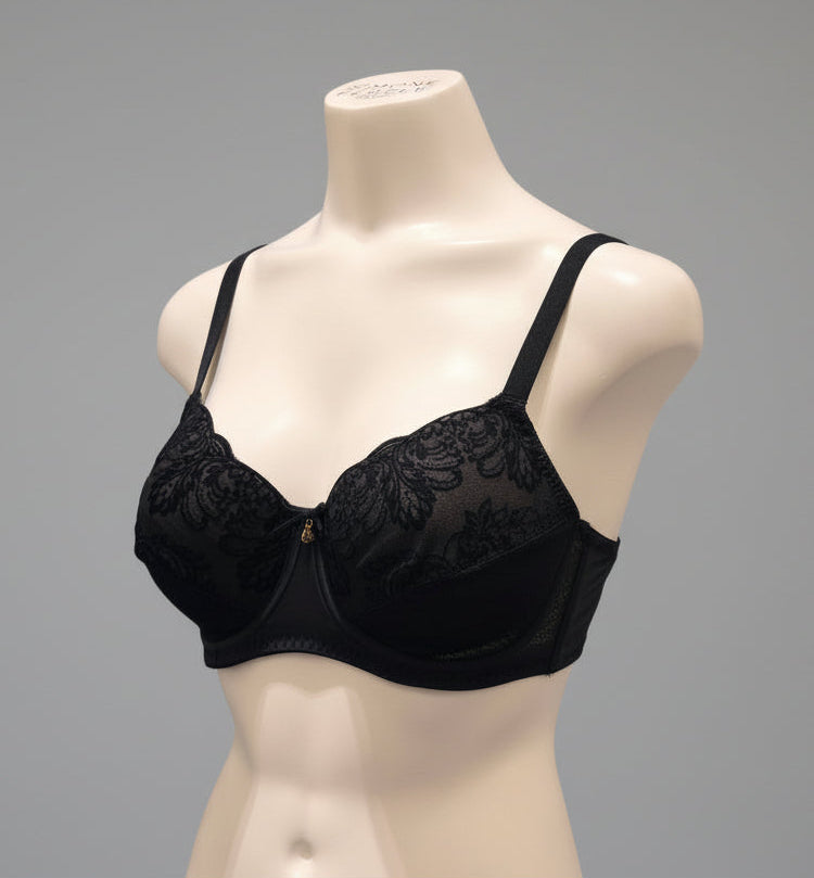 Black lace bra on a mannequin against a dark blue background
