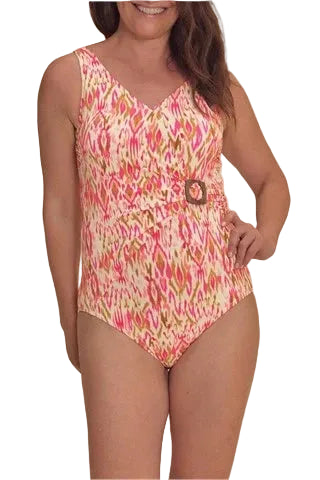 Woman wearing a colorful patterned swimsuit on a beige background