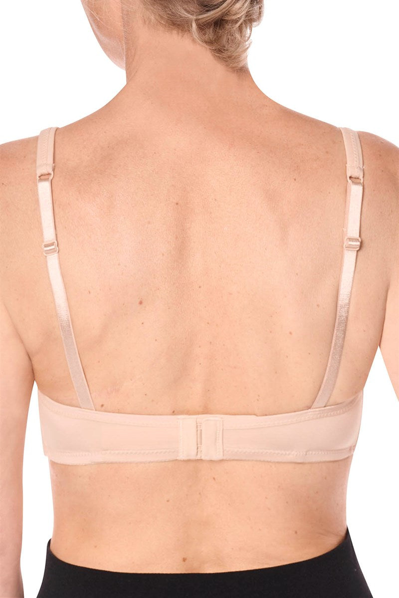 Beige bra worn by a person on a white background