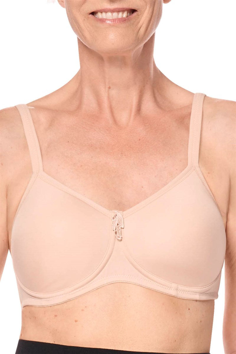 Woman wearing a beige bra on a white background