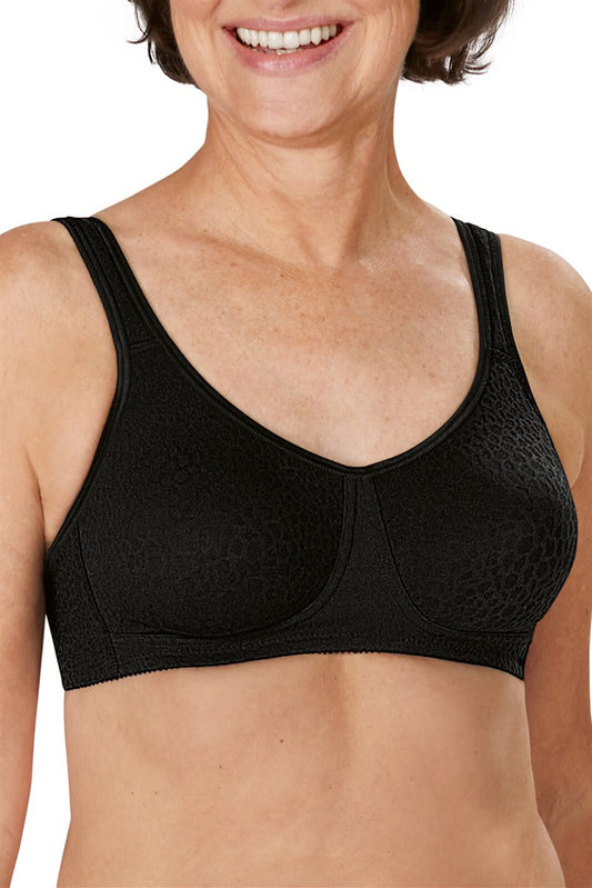 Woman wearing a black sports bra on a white background