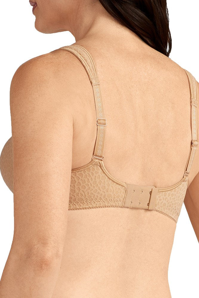 Beige bra worn by a person on a white background
