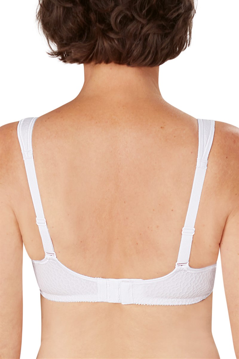 White bra on a model with a plain background