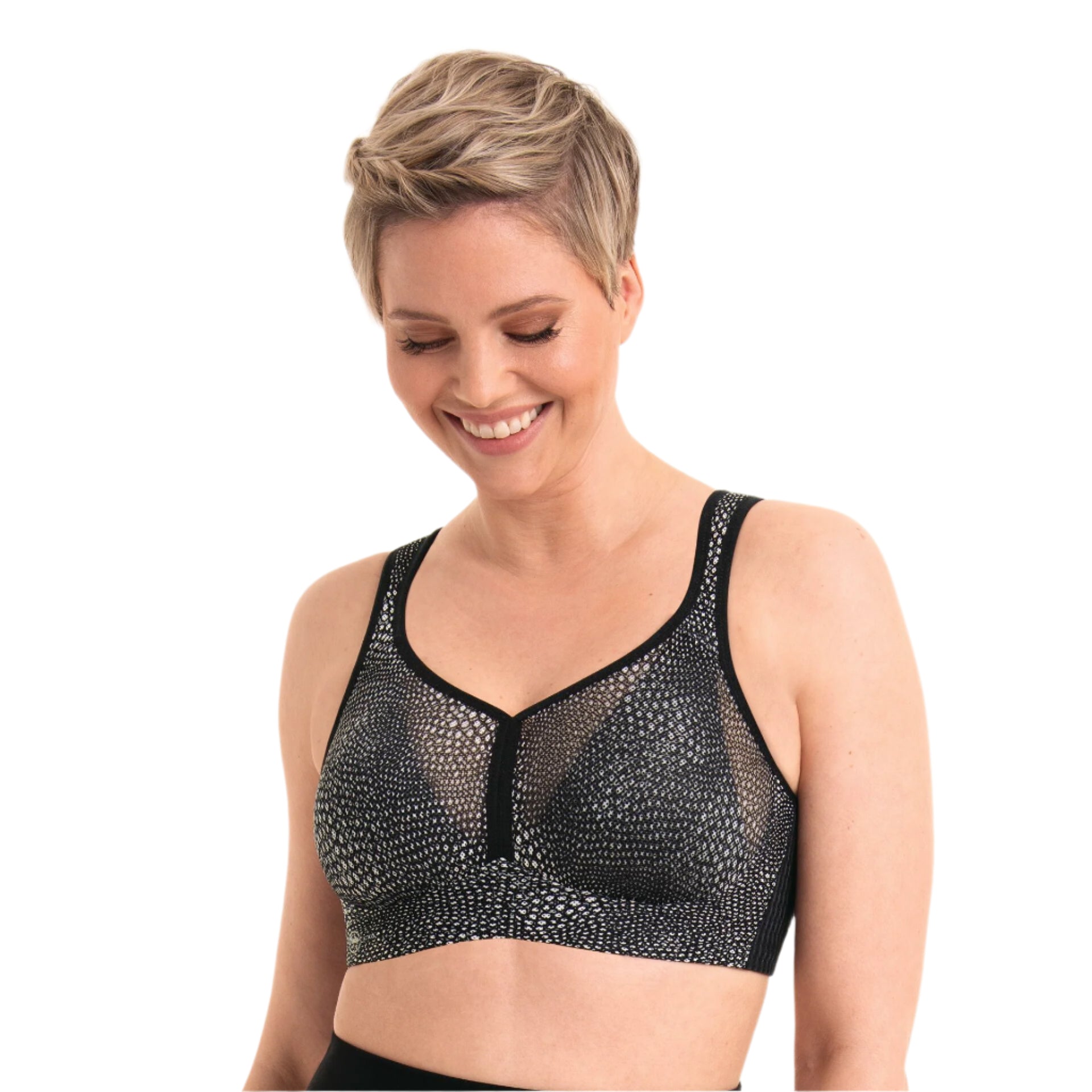 Woman wearing a black mesh sports bra on a white background