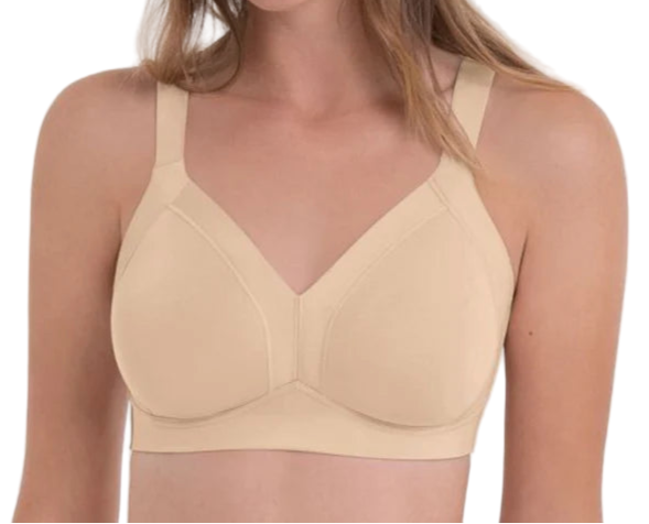 Woman wearing a beige bra against a white background
