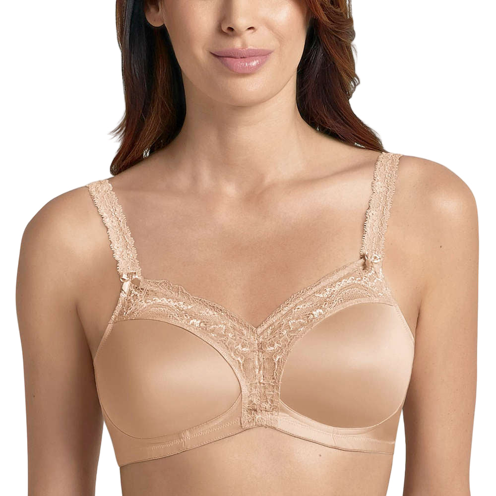 Beige lace bra worn by a model on a white background