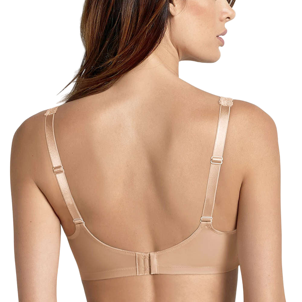 Beige bra worn by a model on a white background