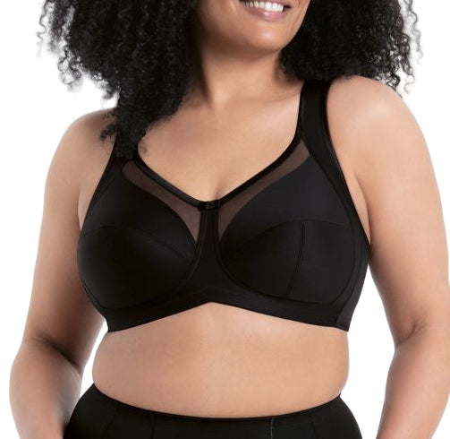 Woman wearing a black bralette on a white background