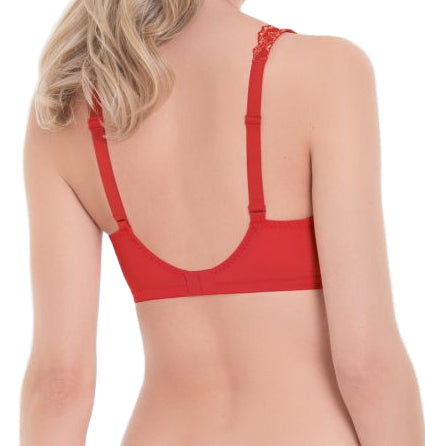 Woman wearing a red bralette on a white background