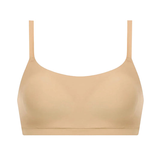 Beige bralette with thin straps on a white background