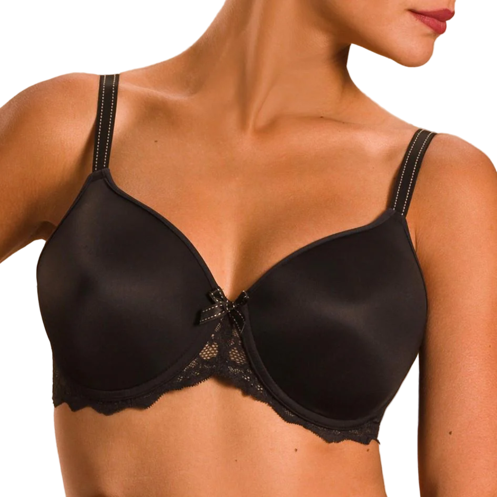 Black bra with lace details on a beige background