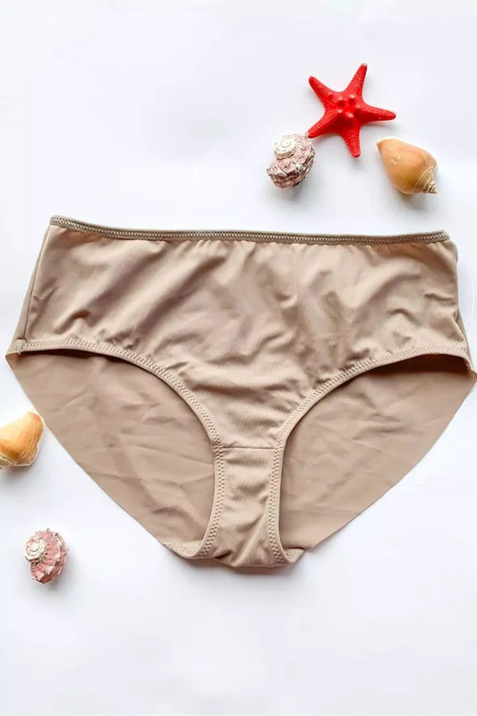 Beige women's underwear on a white background with starfish and shells.