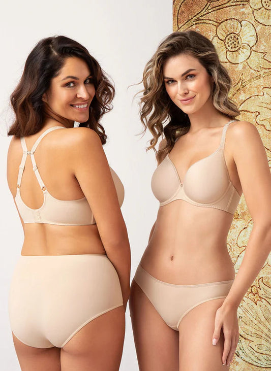 Two women wearing beige lingerie against a neutral background