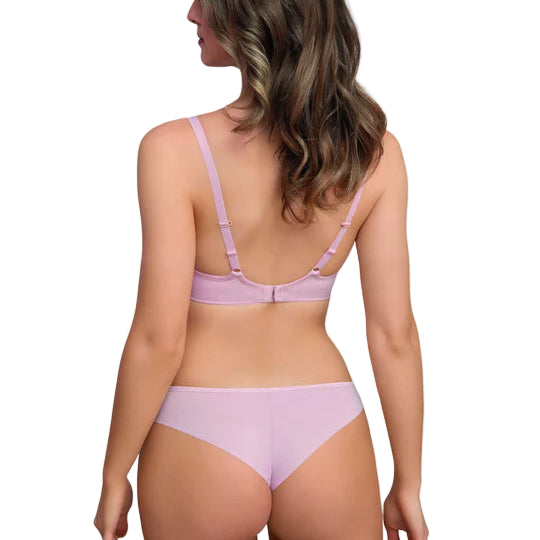 Woman wearing a light purple bra and panties set on a white background