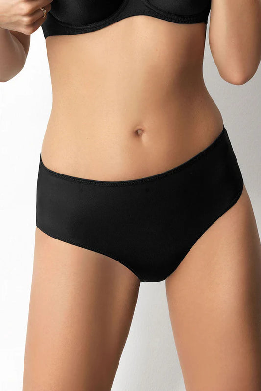 Person wearing black underwear on a plain background