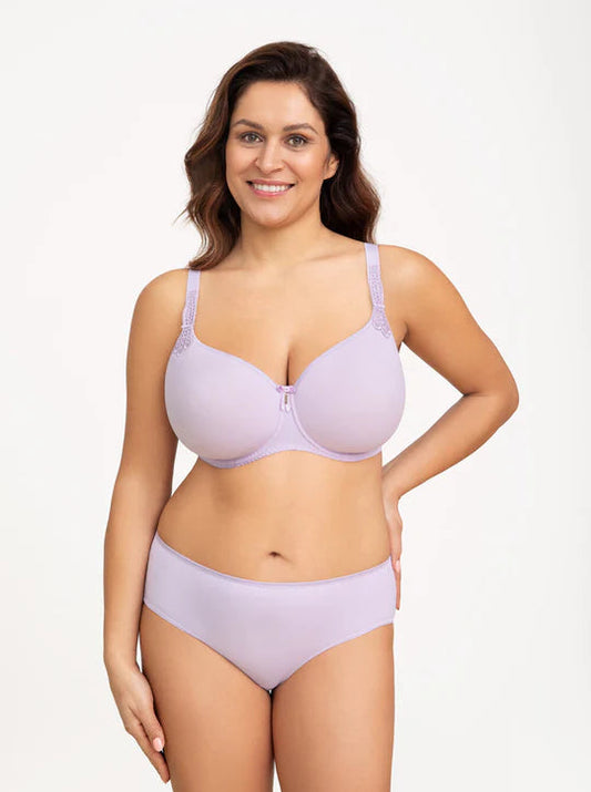 Woman wearing a lavender bra and panties set on a white background