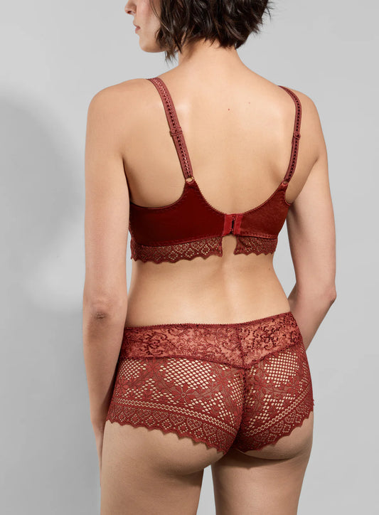 Red lace lingerie set on a gray background