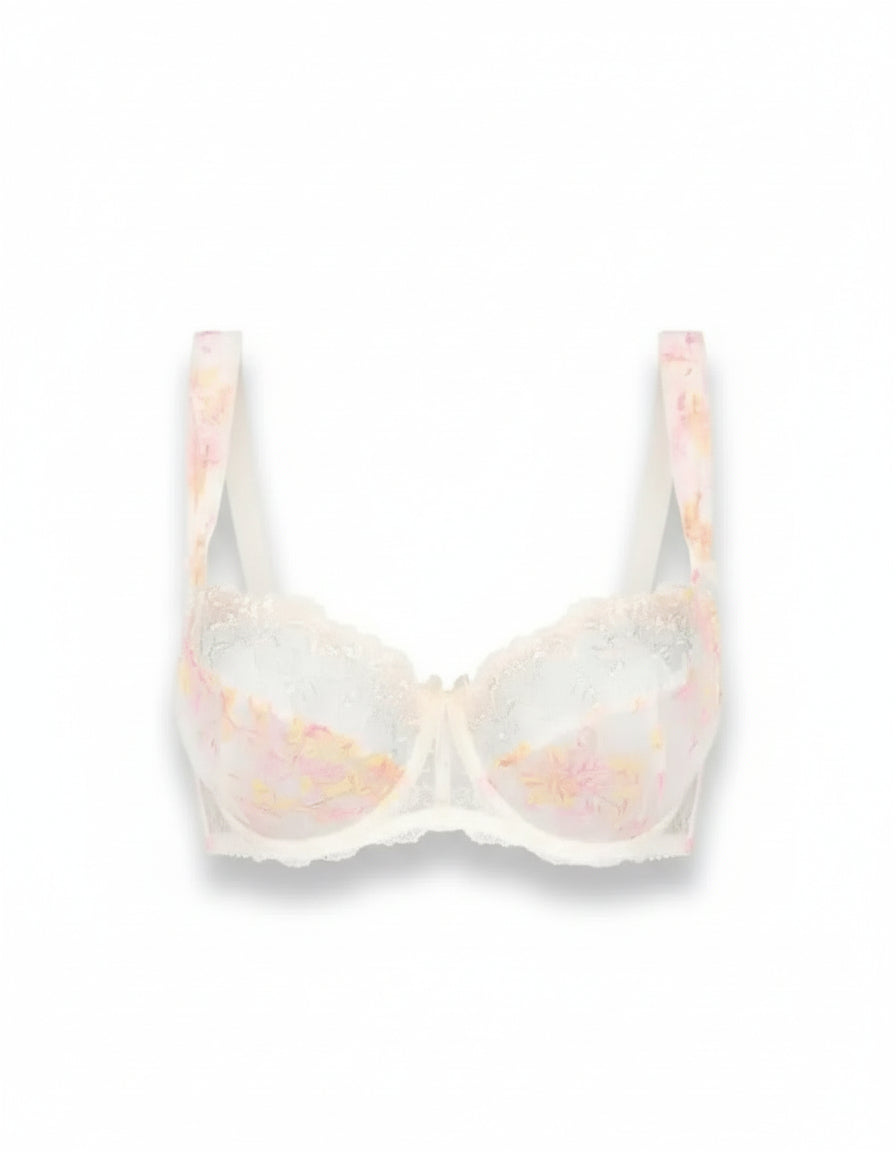 White bra with pink floral pattern on a white background