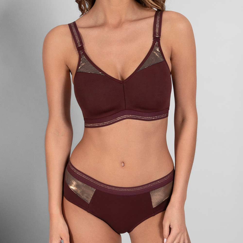 Burgundy bra and panties set on a model against a gray background