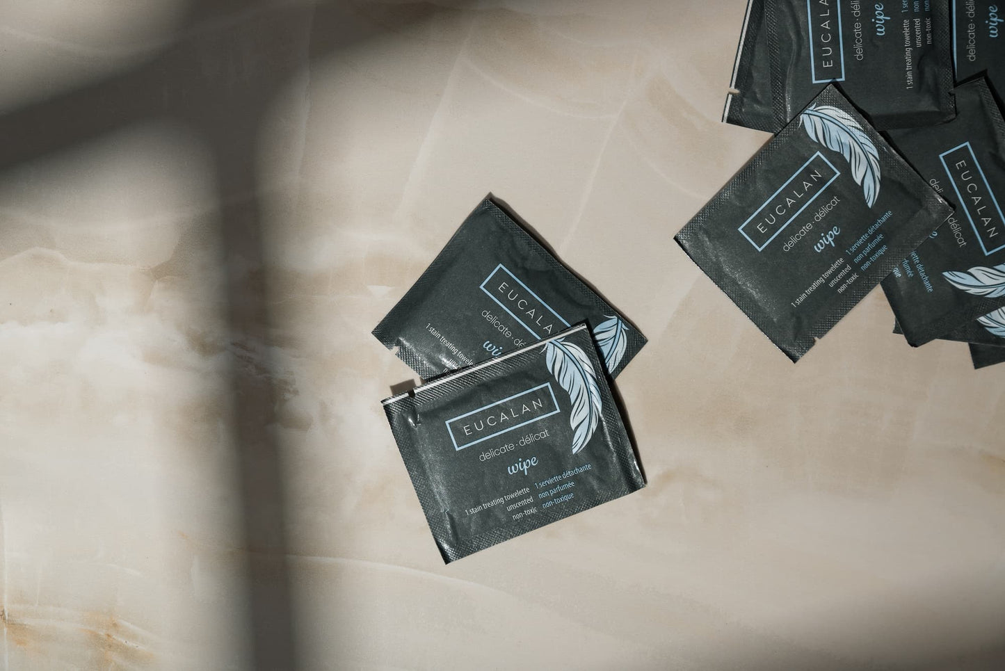 Eucalan brand wipes on a marble surface