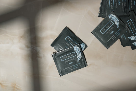 Eucalan brand wipes on a marble surface