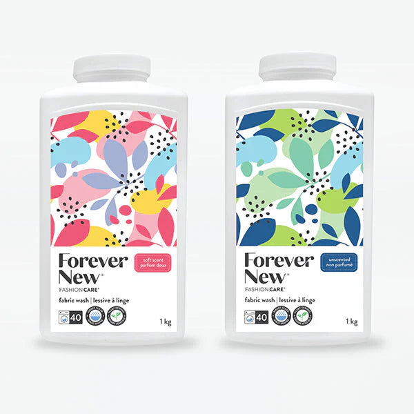 Two packages of Forever New fabric wash with colorful labels on a white background