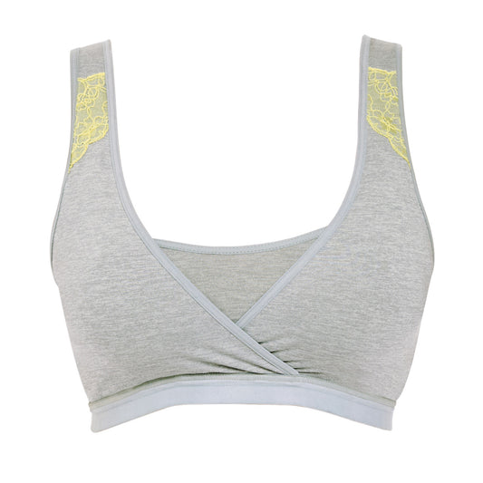Gray sports bra with yellow accents on a white background
