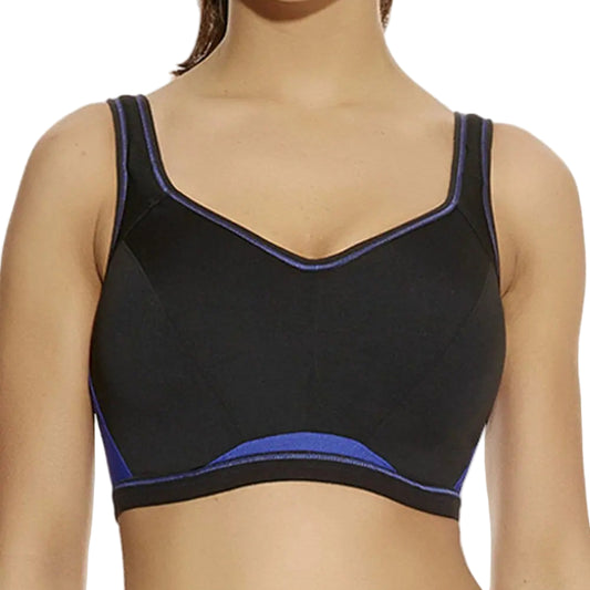 Black sports bra with blue trim worn by a model on a white background
