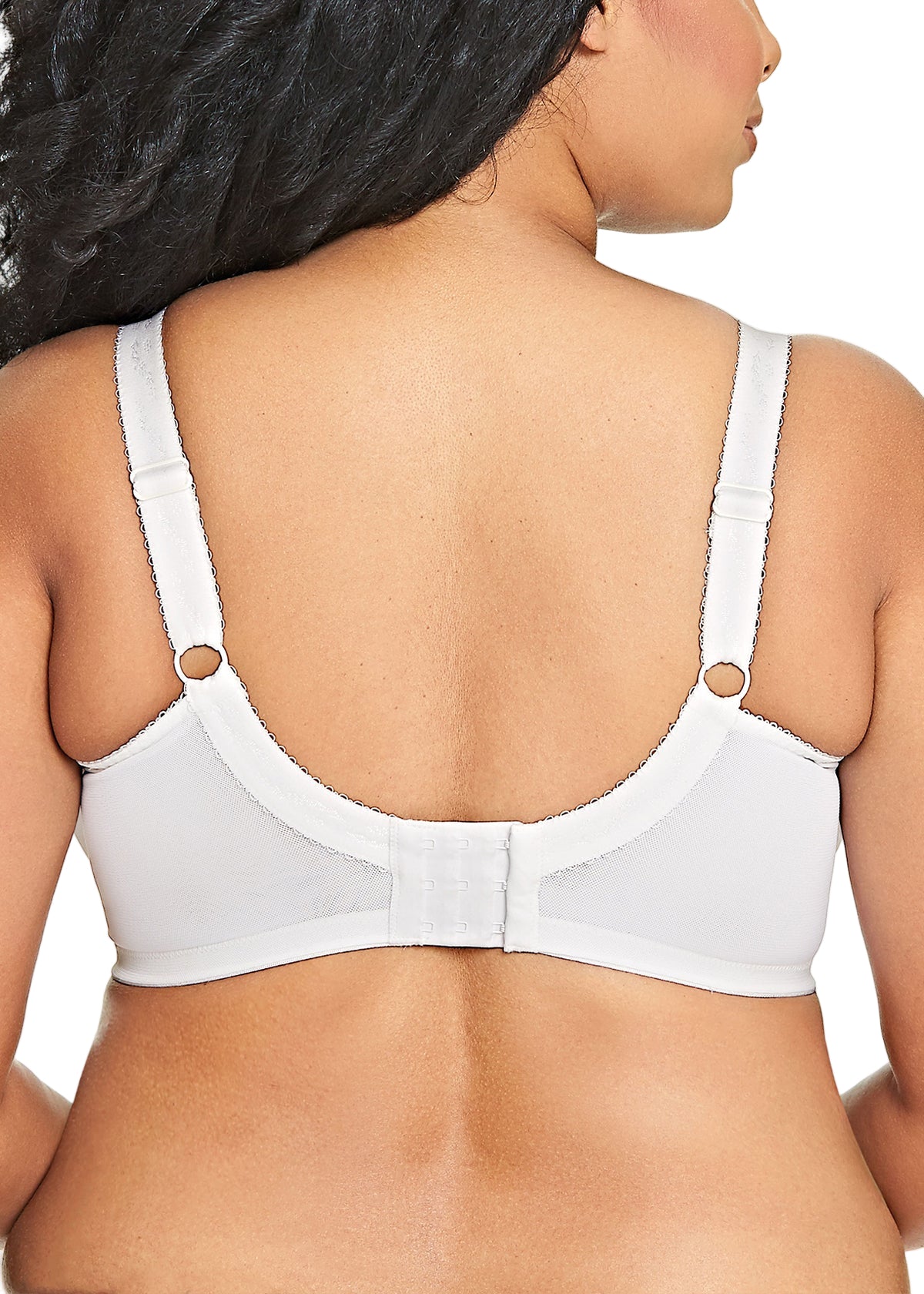 White bra worn by a person on a white background