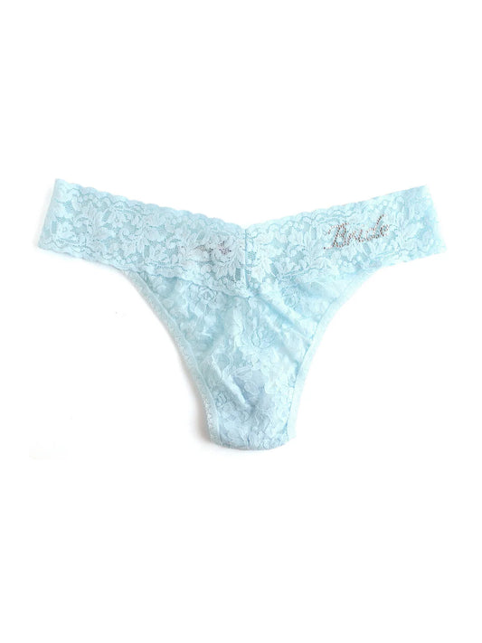 Light blue lace thong with 'Brides' embroidery on a white background