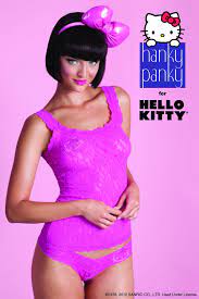 Model wearing a pink outfit with Hello Kitty branding on a pink background