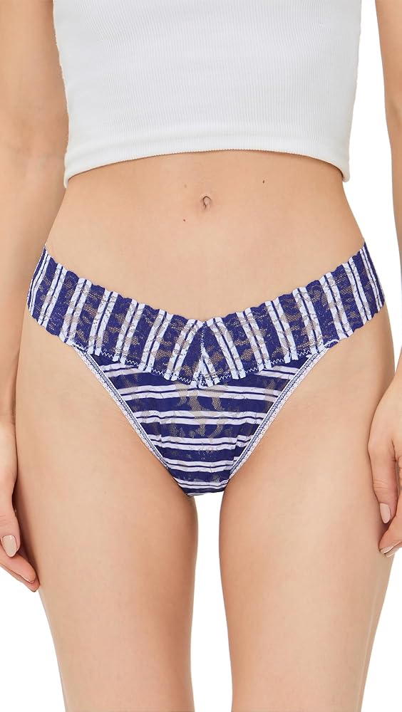 Person wearing blue and white striped underwear with a white top.