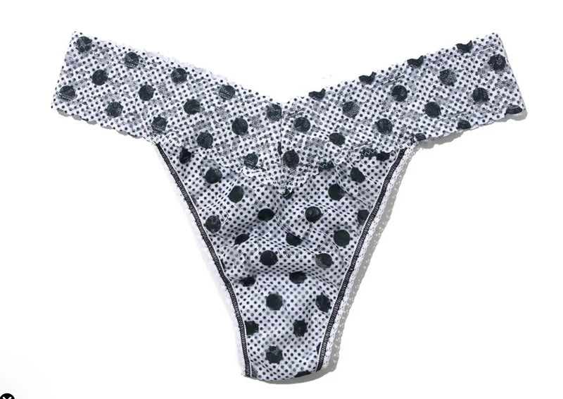 Black polka dot bikini bottom on a white background