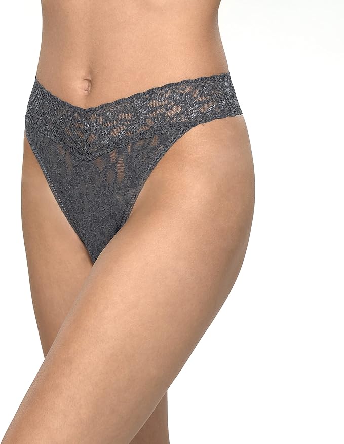 Lace underwear worn by a person on a white background