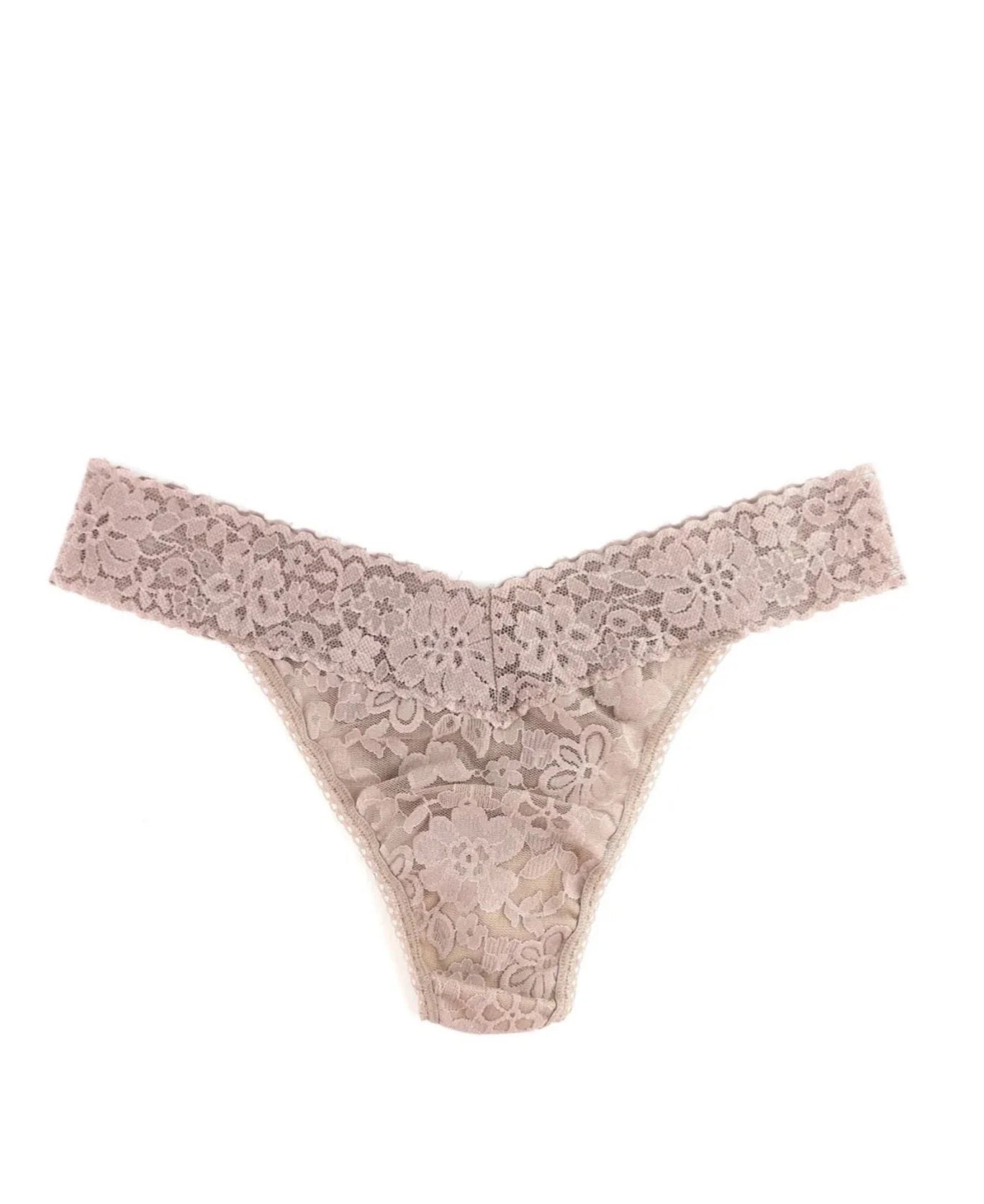 Beige lace thong on a white background
